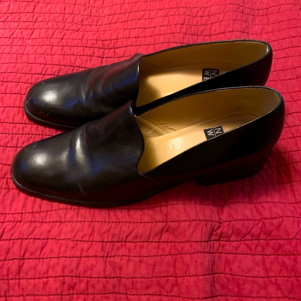 Black loafers, low heel.